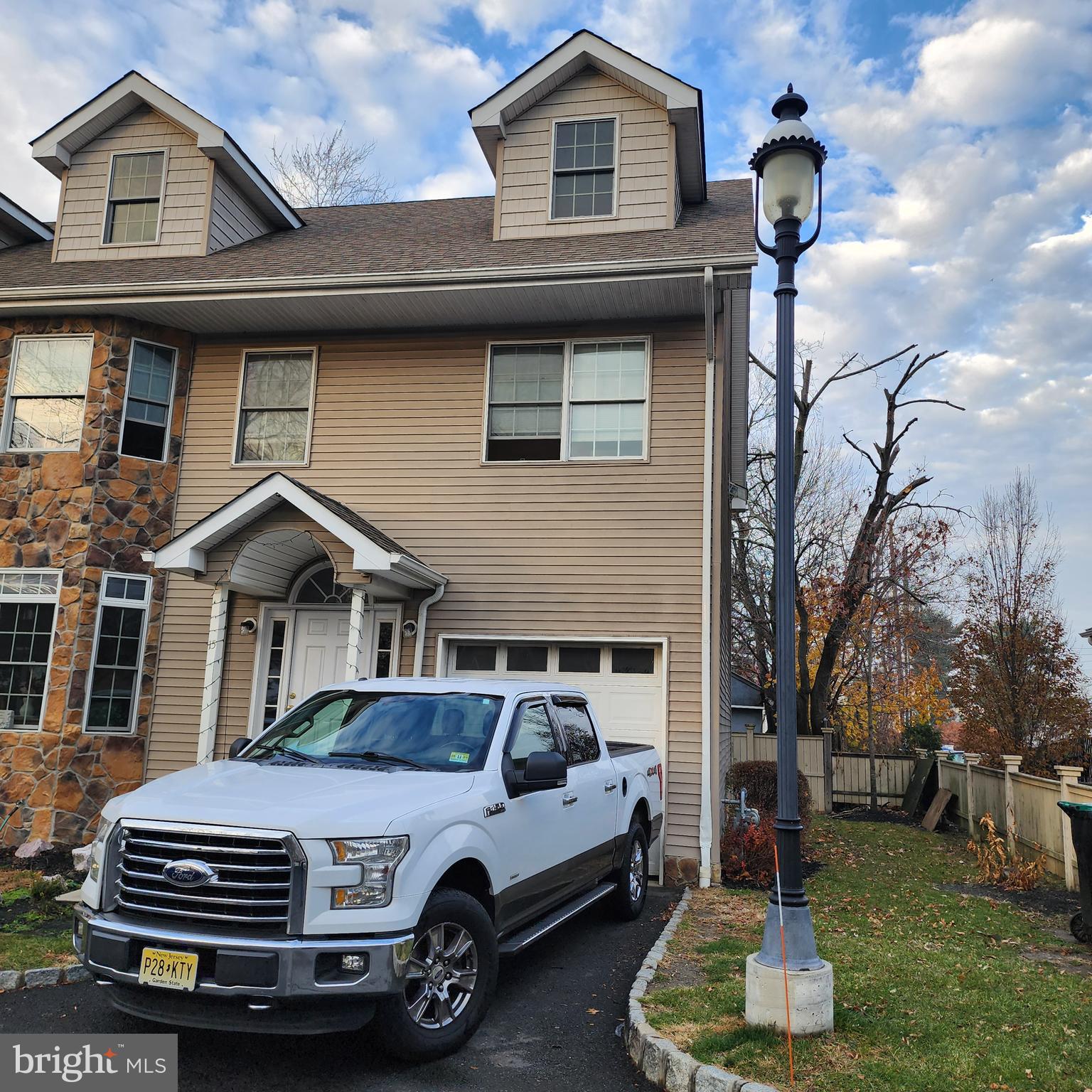 a car parked in front of a house