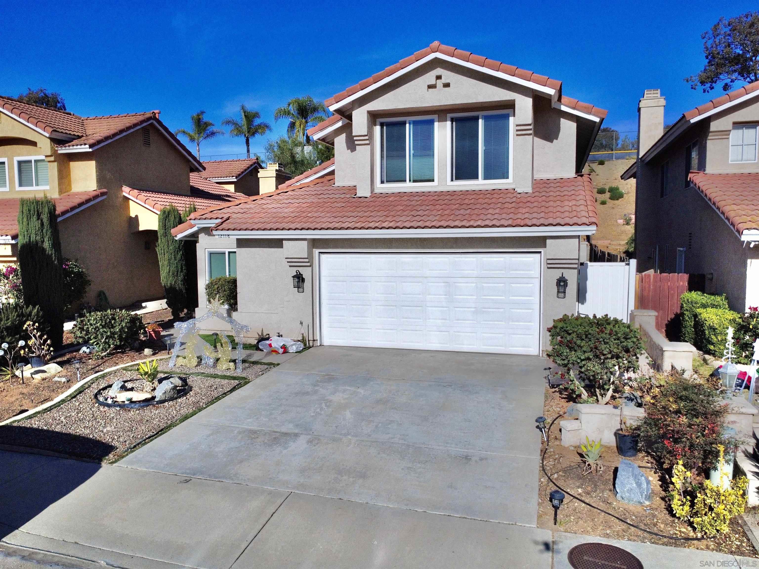 a front view of a house with yard