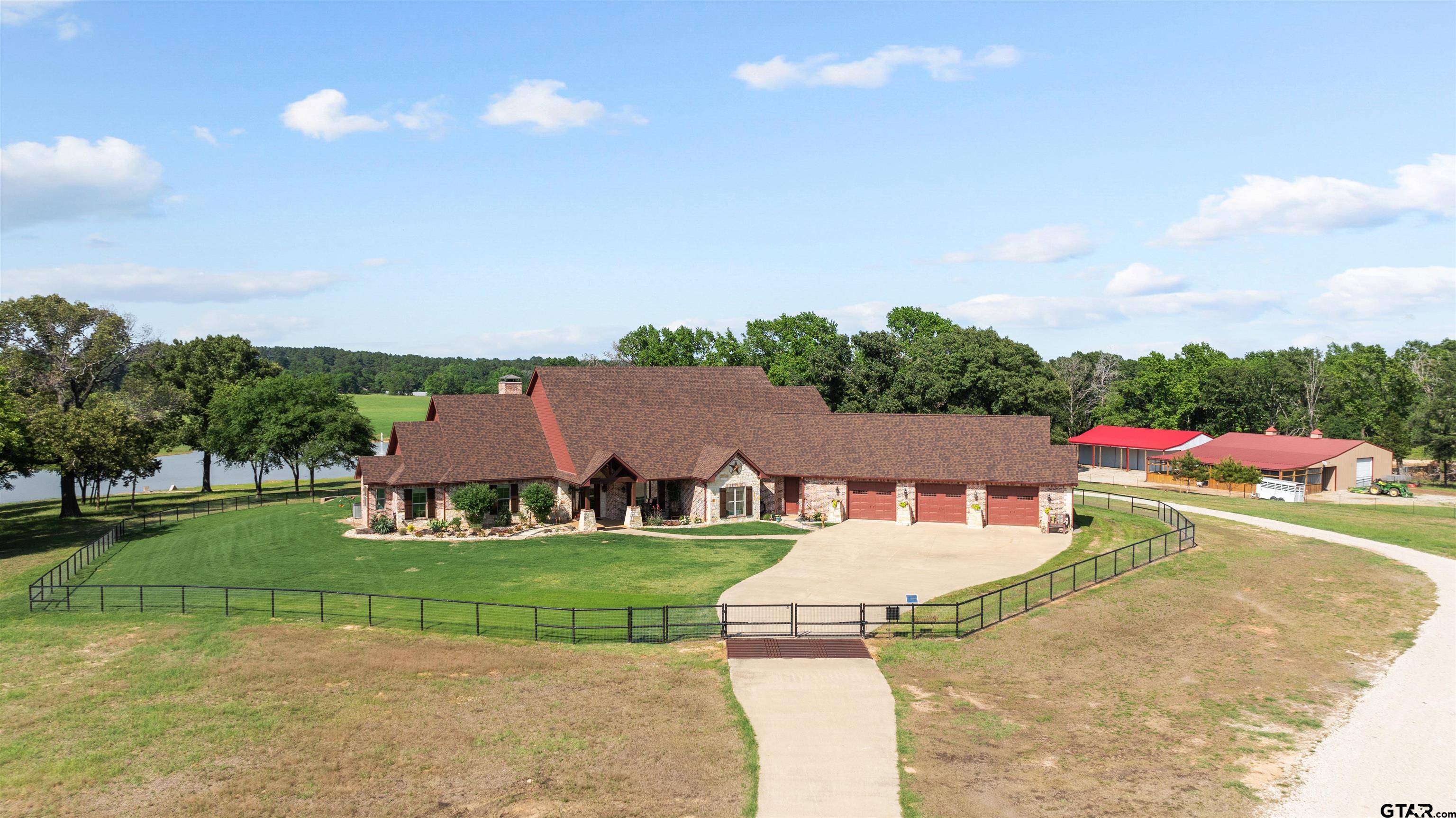 a view of yard with swimming pool and green space