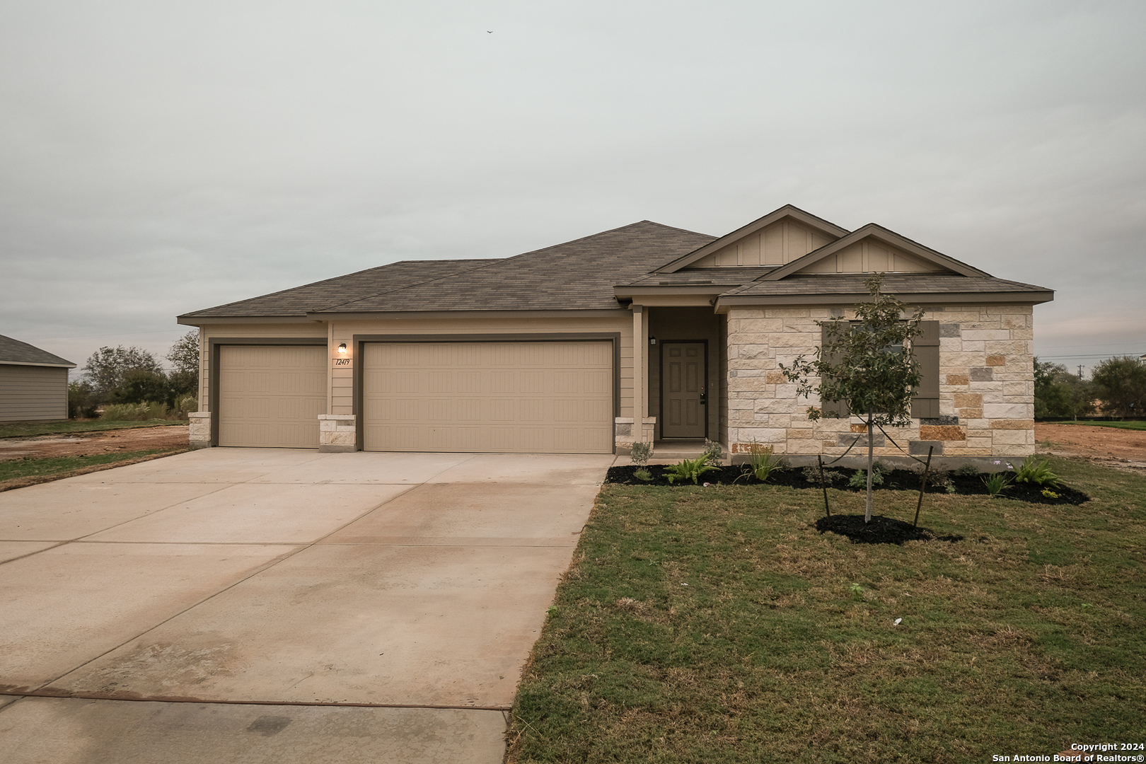 a front view of a house with a yard