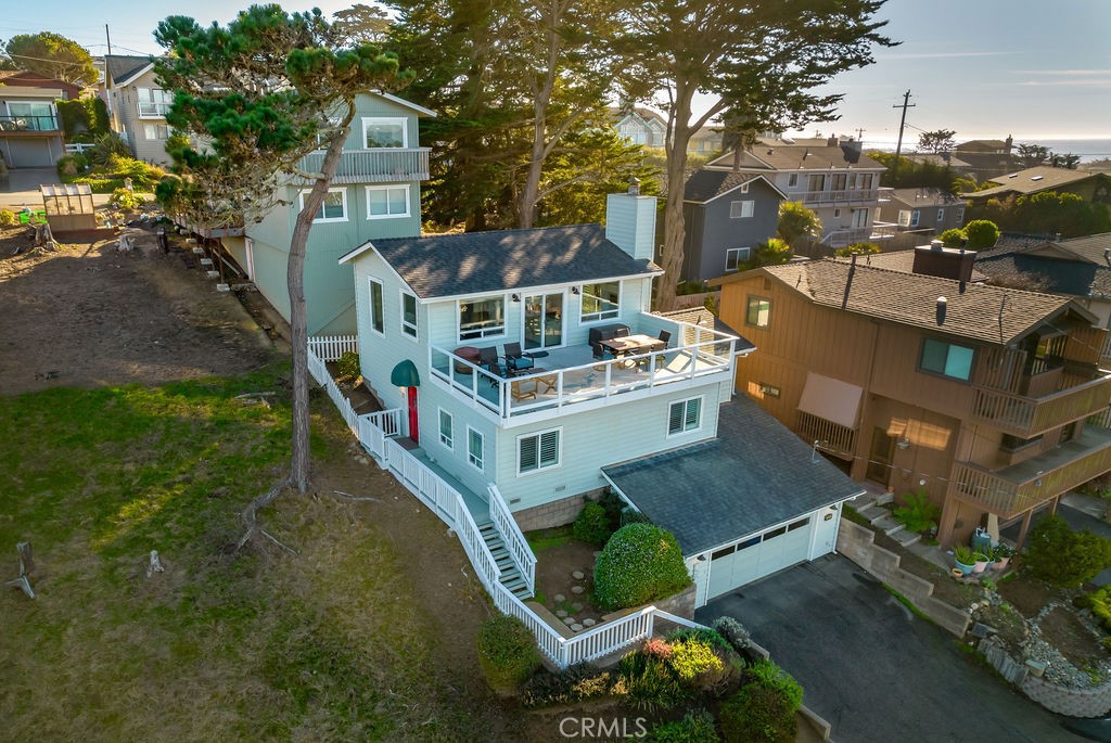 an aerial view of a house with yard swimming pool and outdoor seating