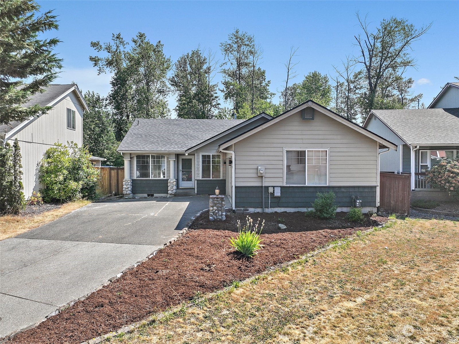 a front view of a house with a yard and porch