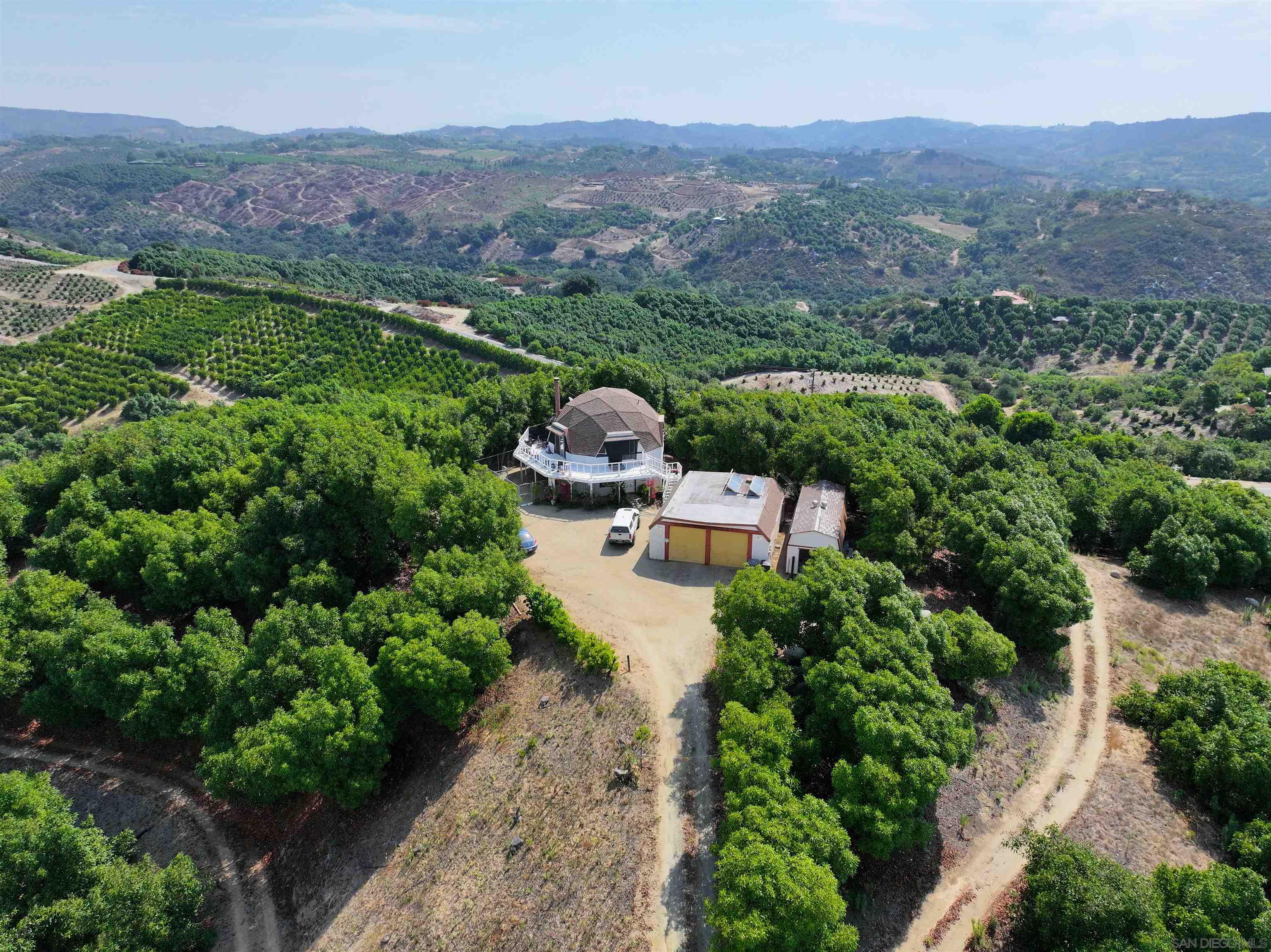 an aerial view of a house with mountain view