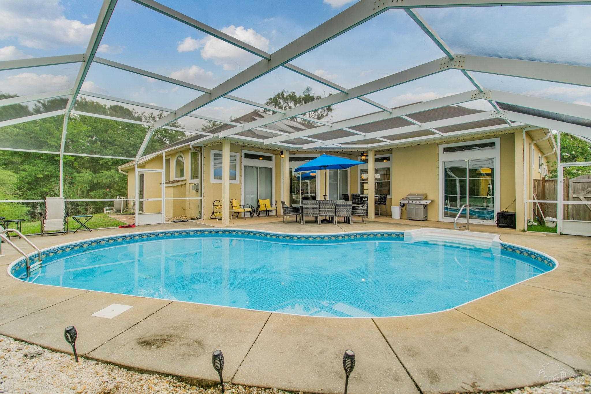 a view of a swimming pool with a patio