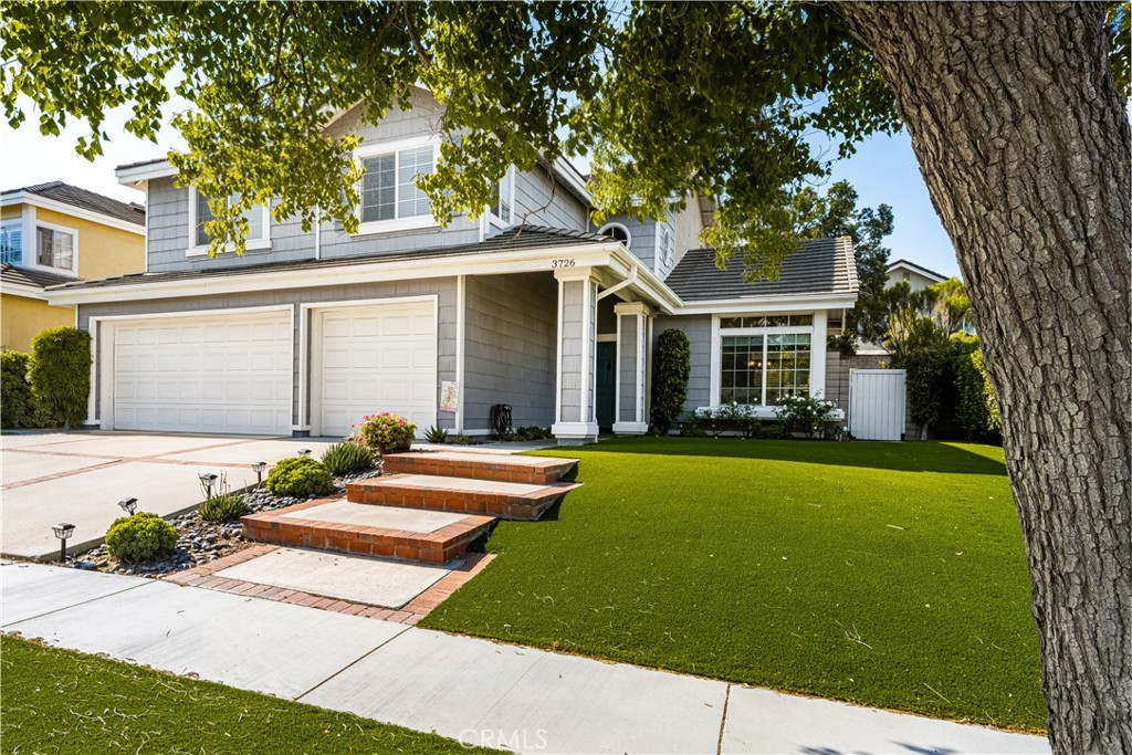 a front view of a house with swimming pool