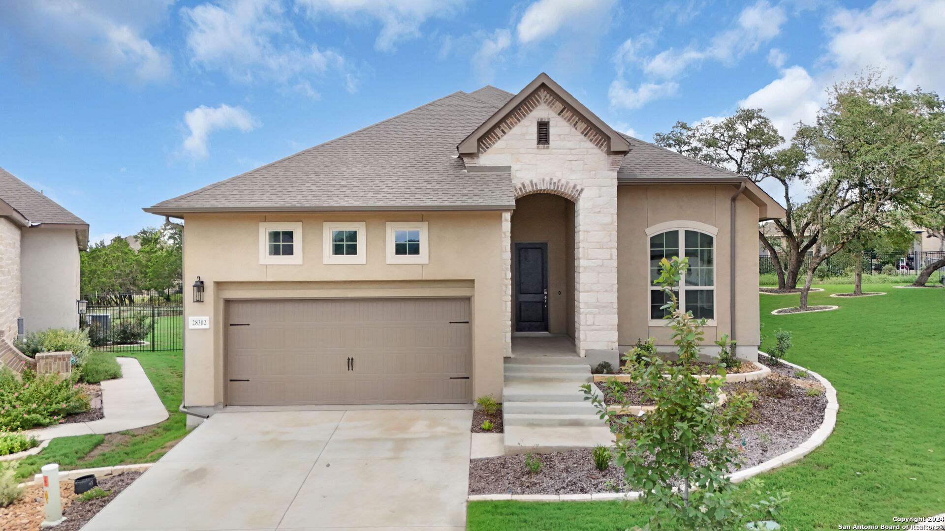 a front view of a house with a yard