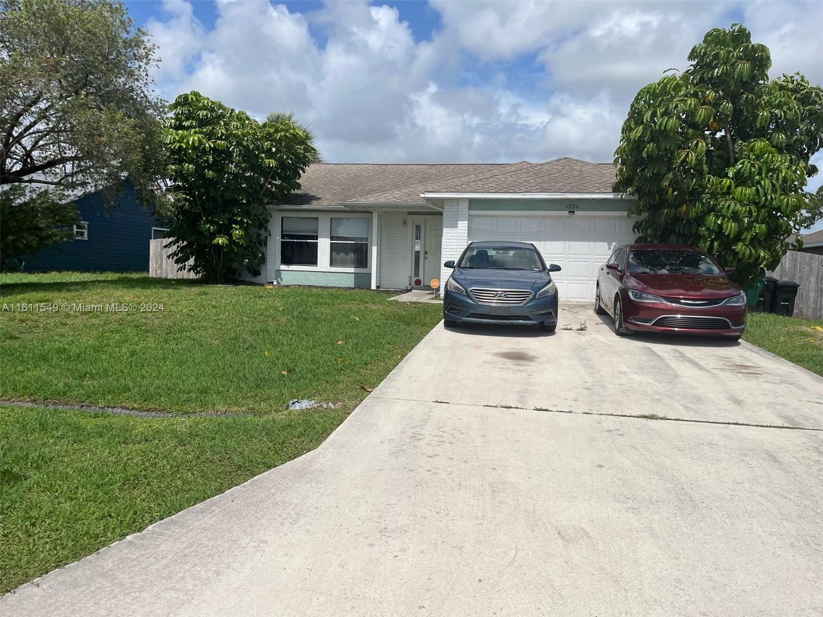 a view of a house with a back yard