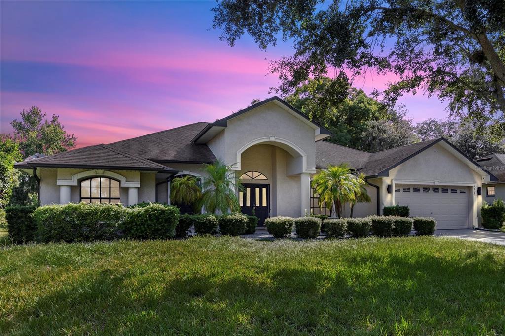 a front view of a house with a yard