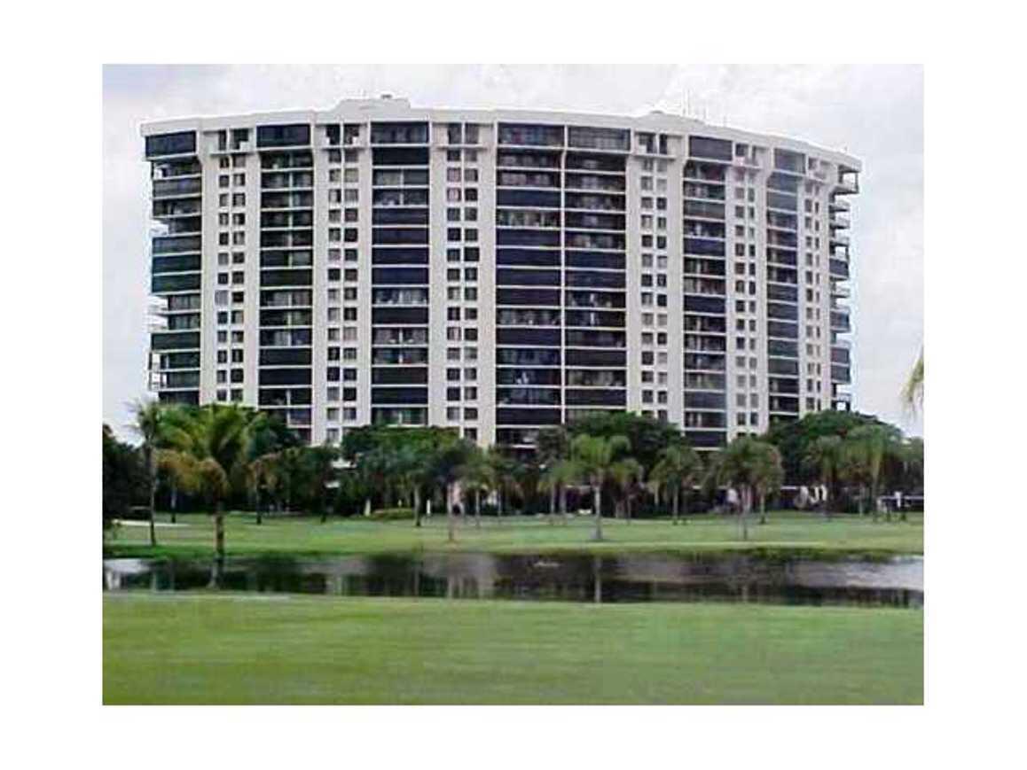 a front view of a building with garden