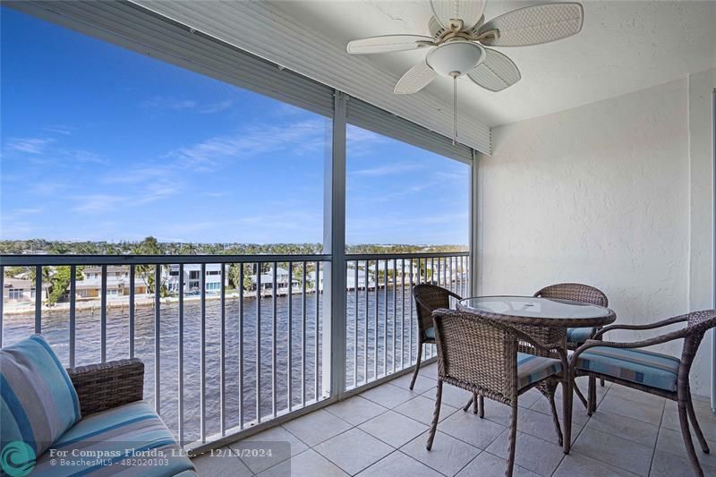 a view of a balcony with furniture