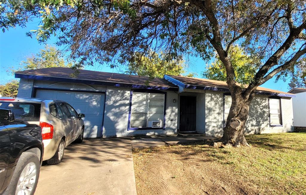 a view of a house with a tree