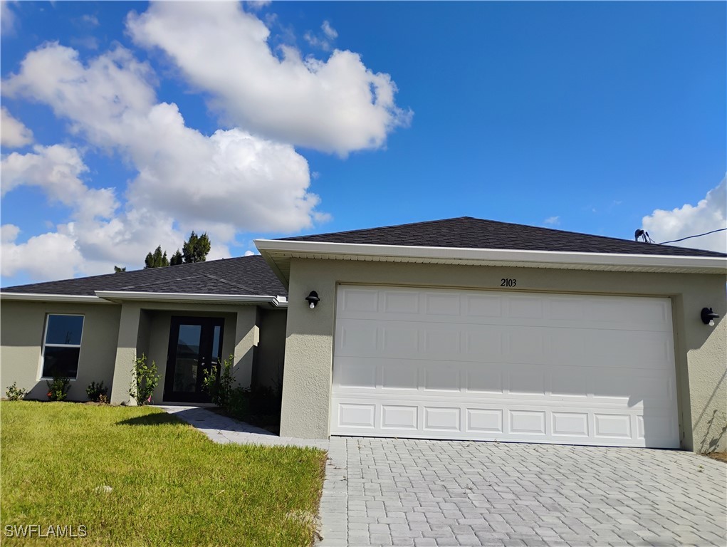 a front view of a house with a yard