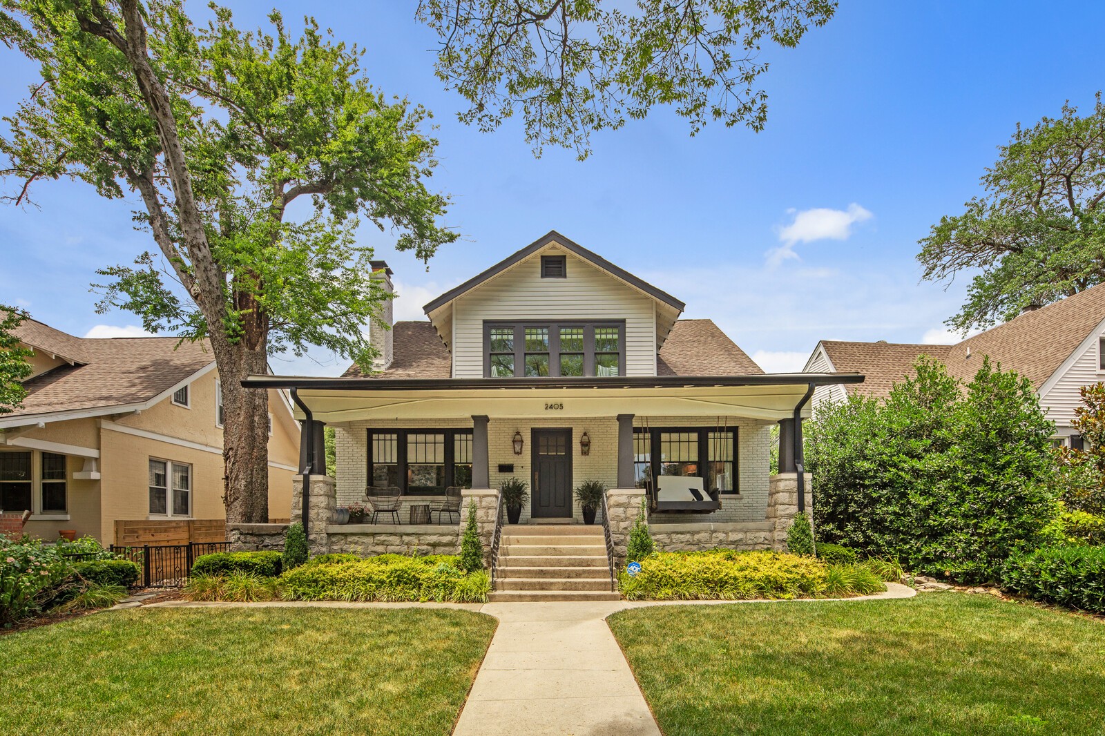 a front view of a house with garden