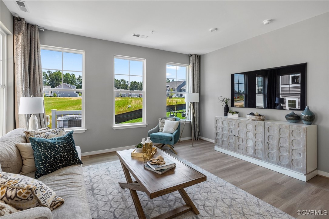 a living room with furniture and a window