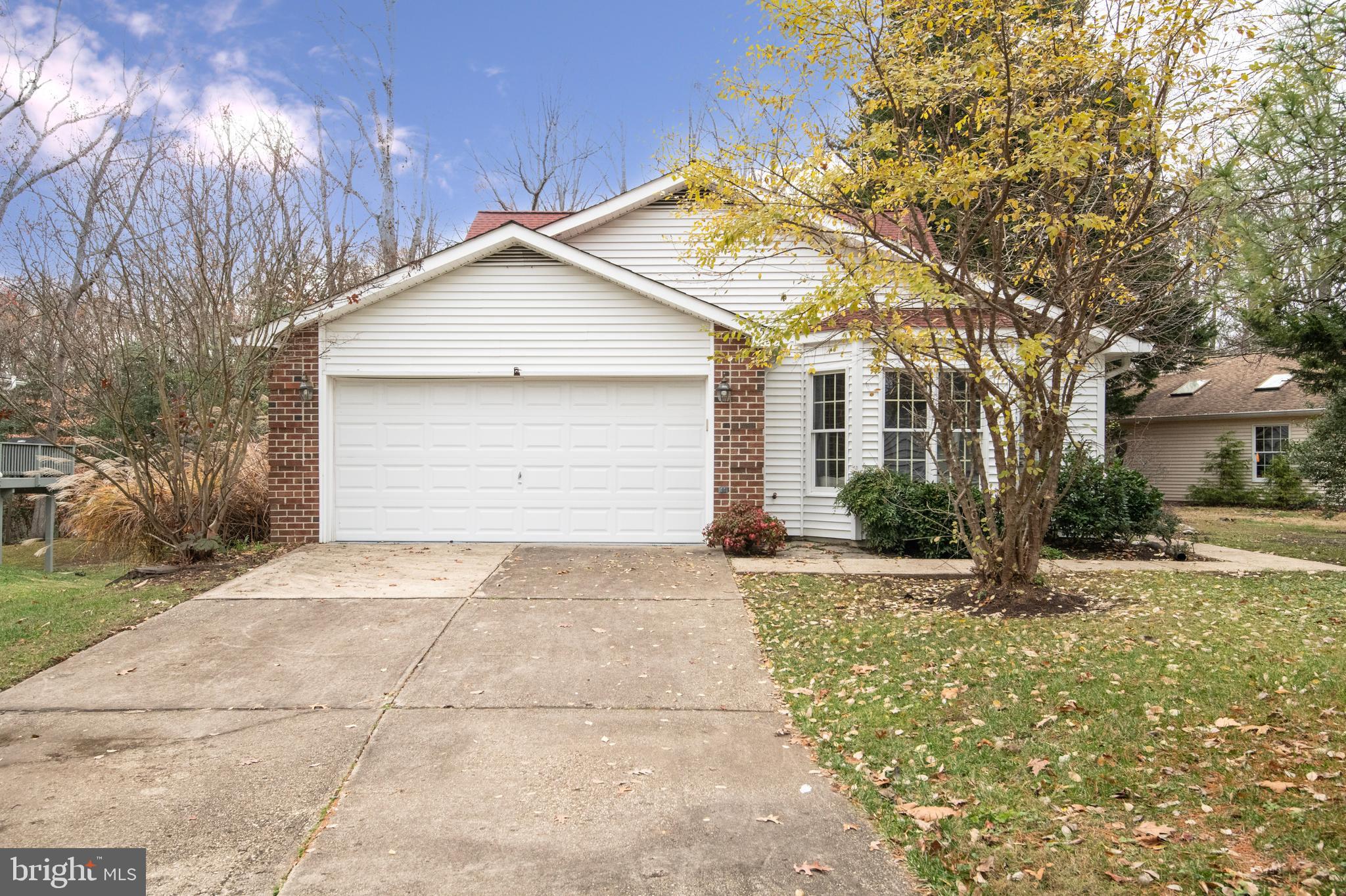 a view of backyard of house and garage