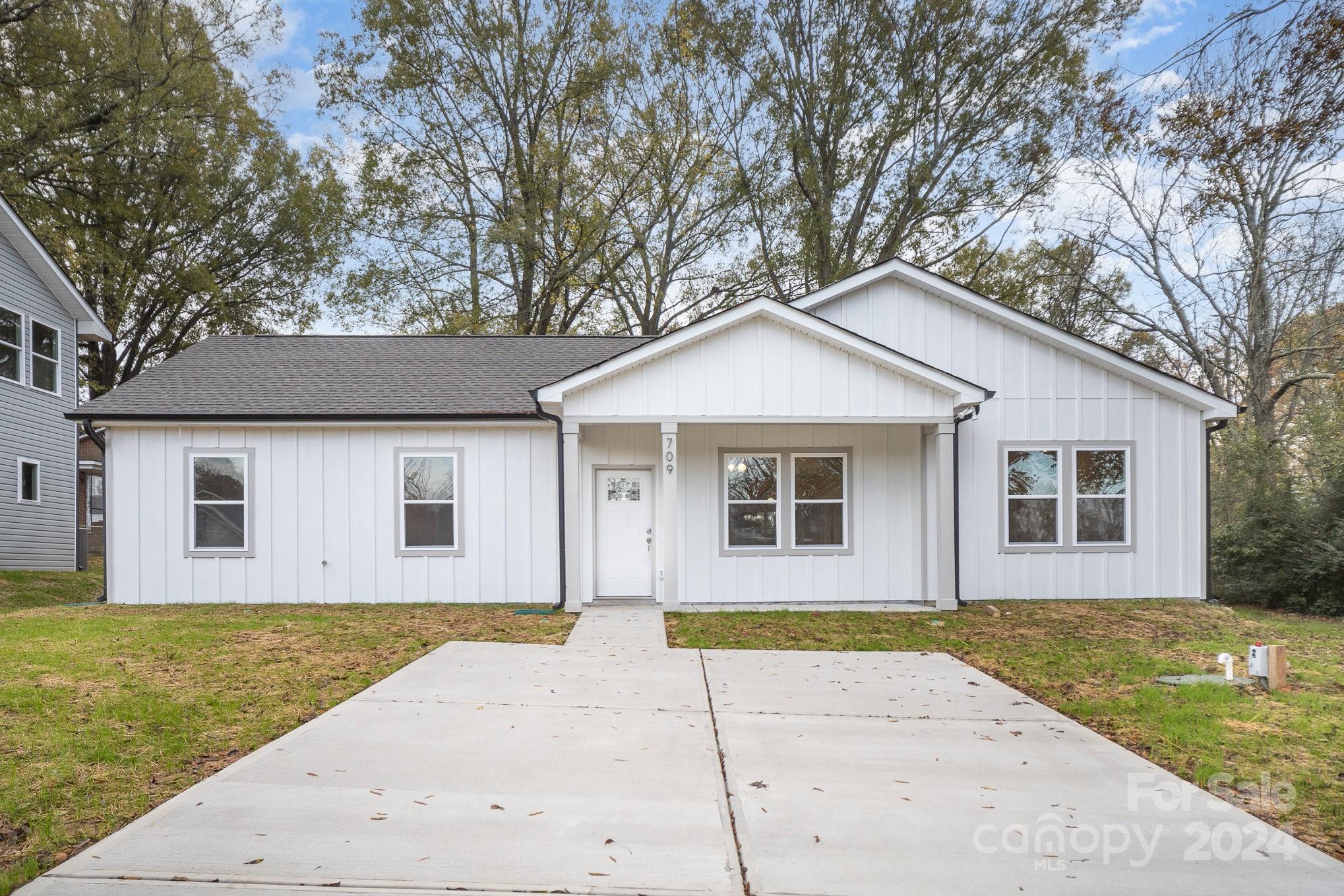 a front view of a house with yard