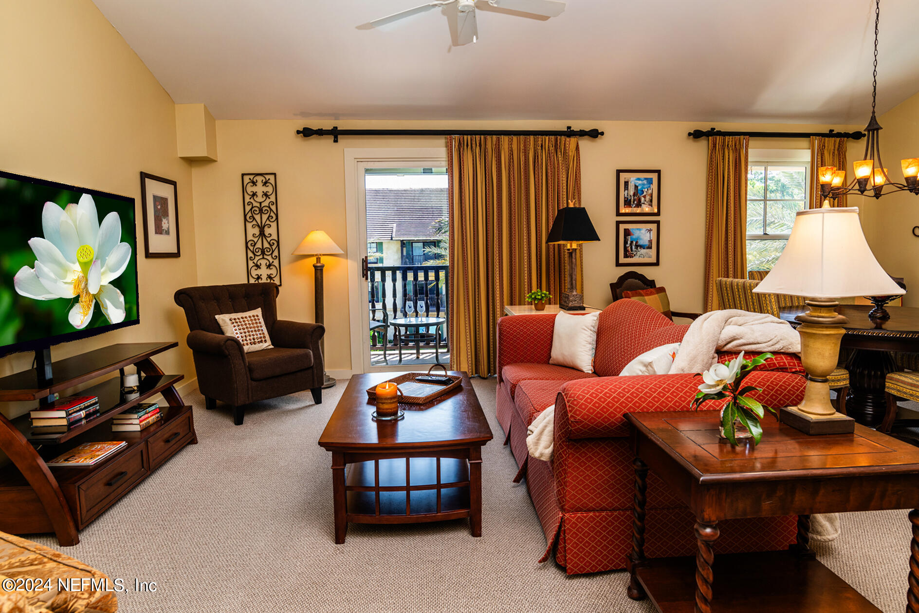 a living room with furniture a rug and a large window