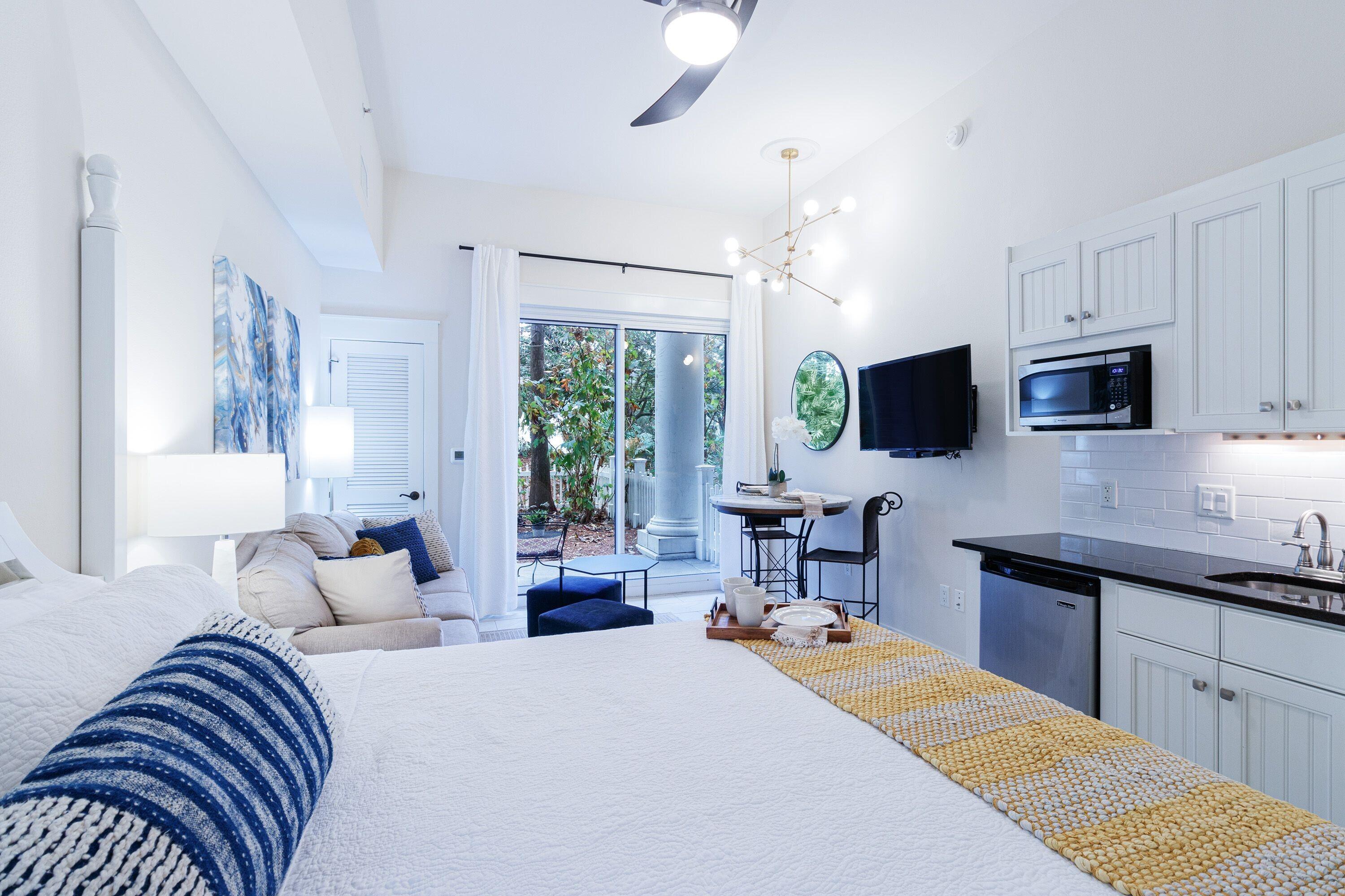 a bedroom with a bed and a flat screen tv