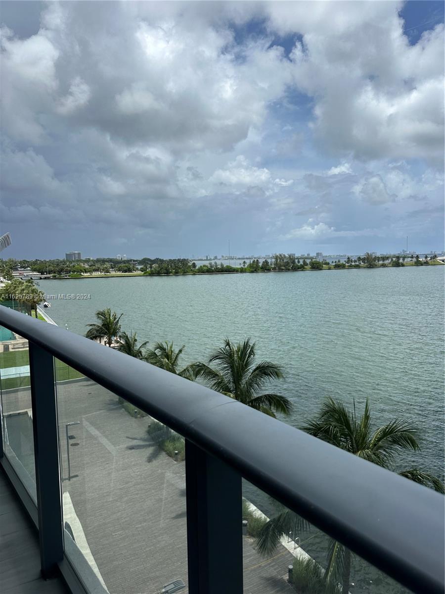 a view of a lake from a balcony