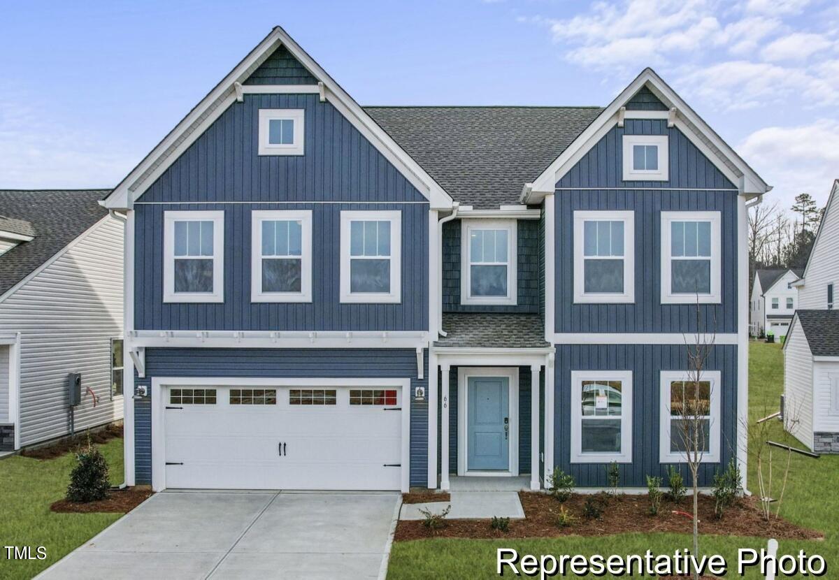 a front view of a house with a garage