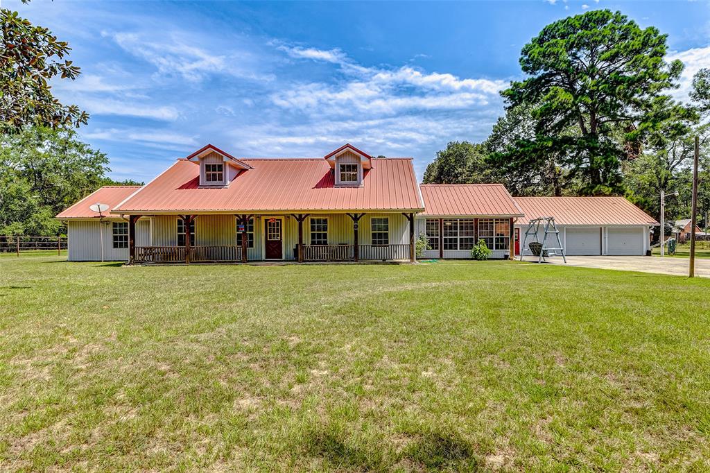 a front view of house with yard and seating area