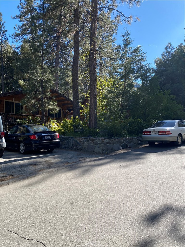 a view of street with parked cars