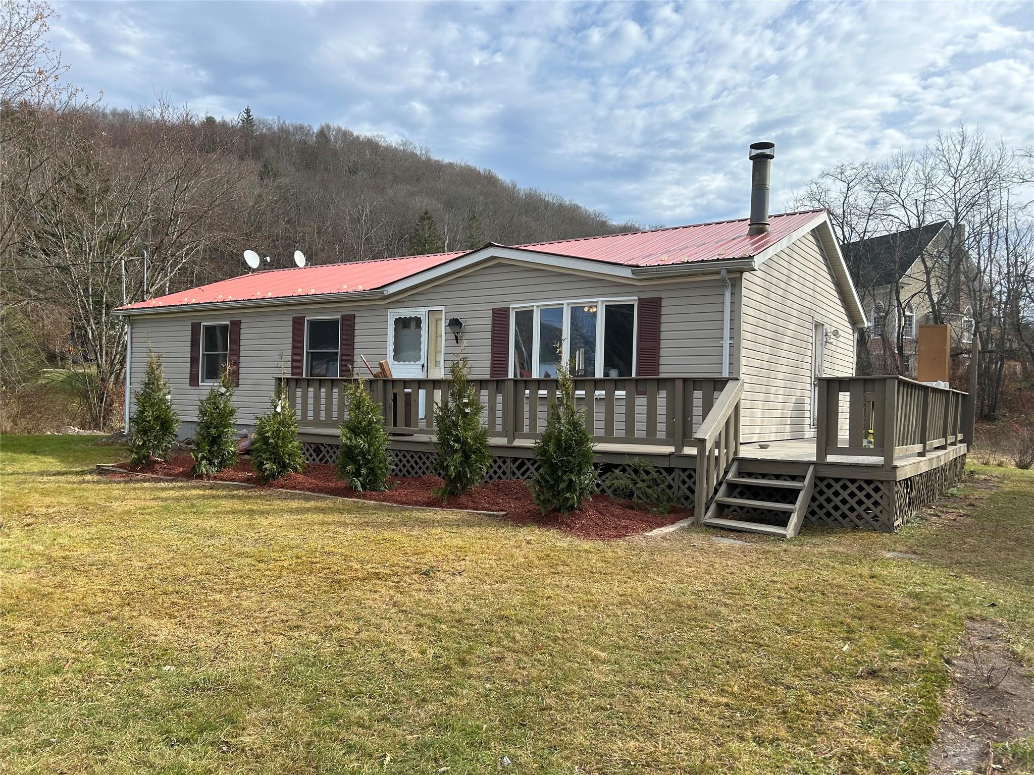 a front view of a house with a yard