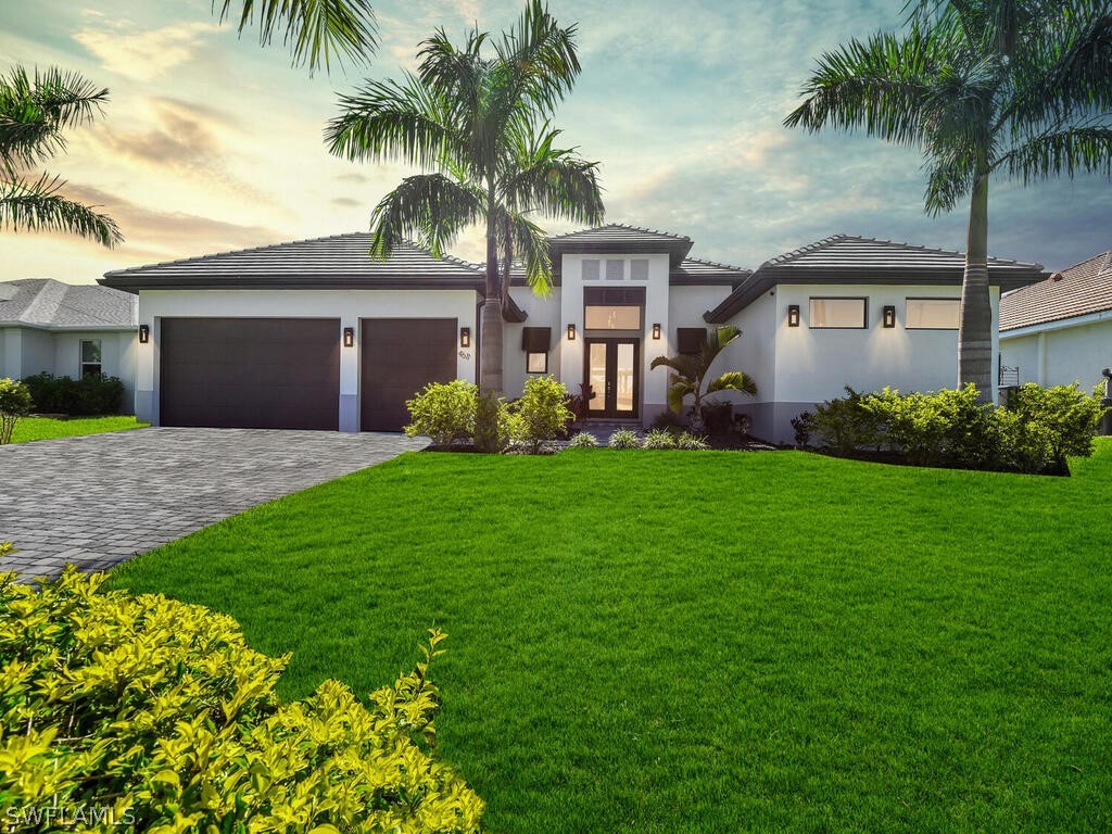 a front view of house with yard and green space