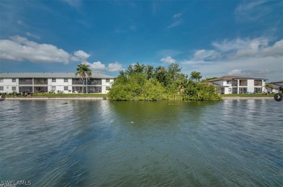 a view of a lake with building in front of it