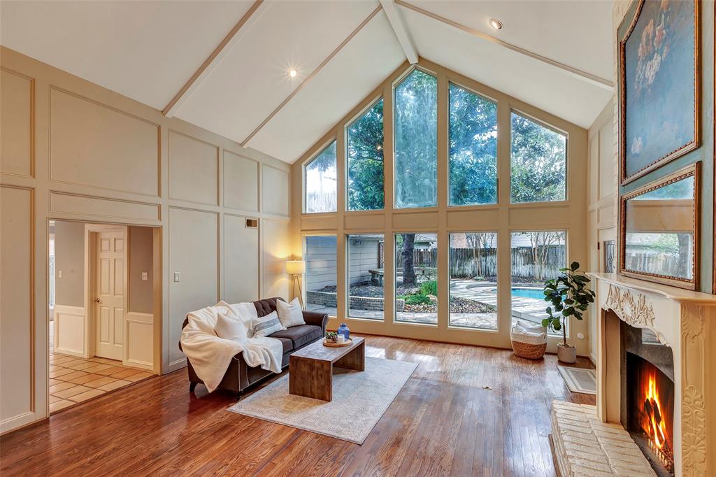 Imagine your holidays centered around this Family Room with gorgeous cathedral ceilings, floor to ceiling windows, and gaslog fireplace.