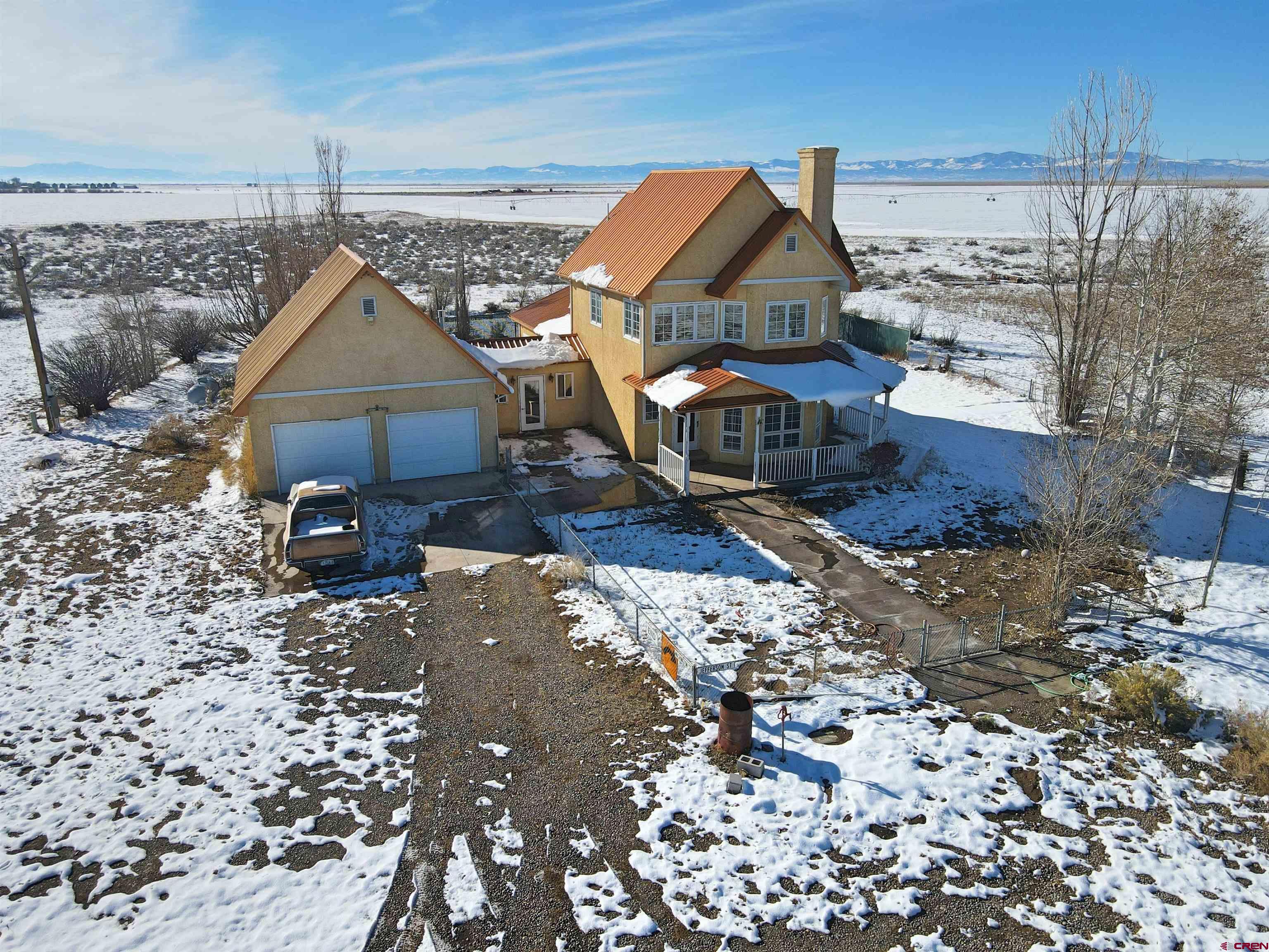 a view of a house with a backyard