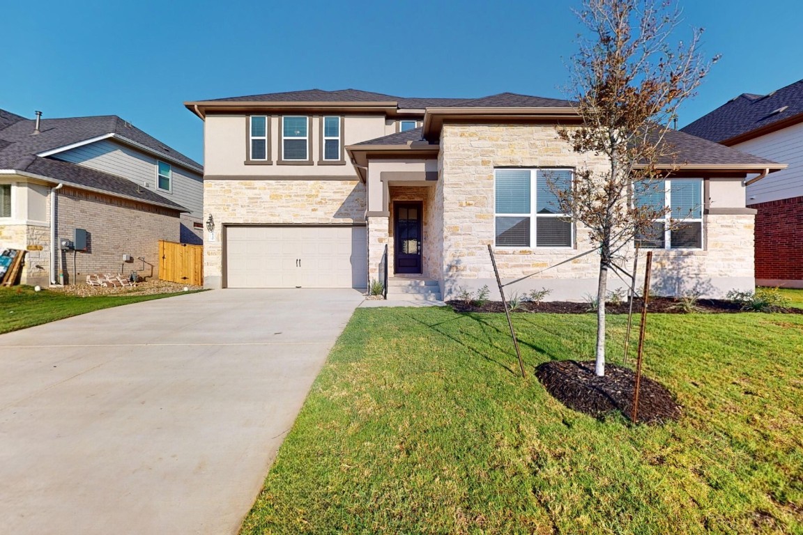 a house view with a garden space