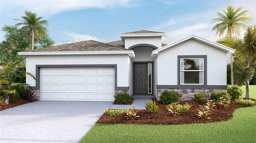 a front view of a house with a yard and garage