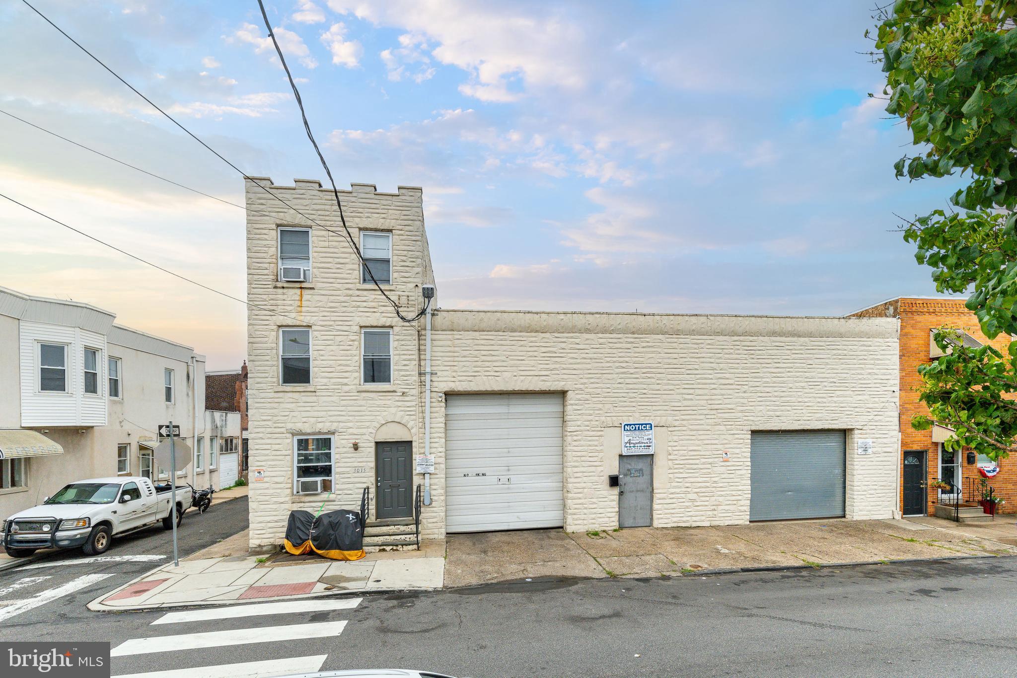 a view of a building with car parked