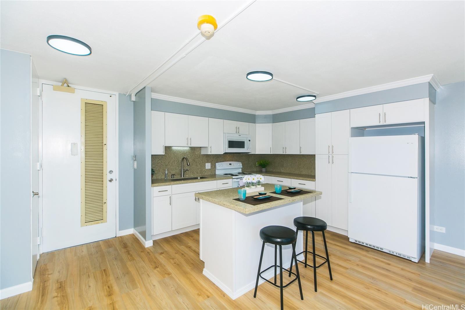 a kitchen with a table and chairs in it