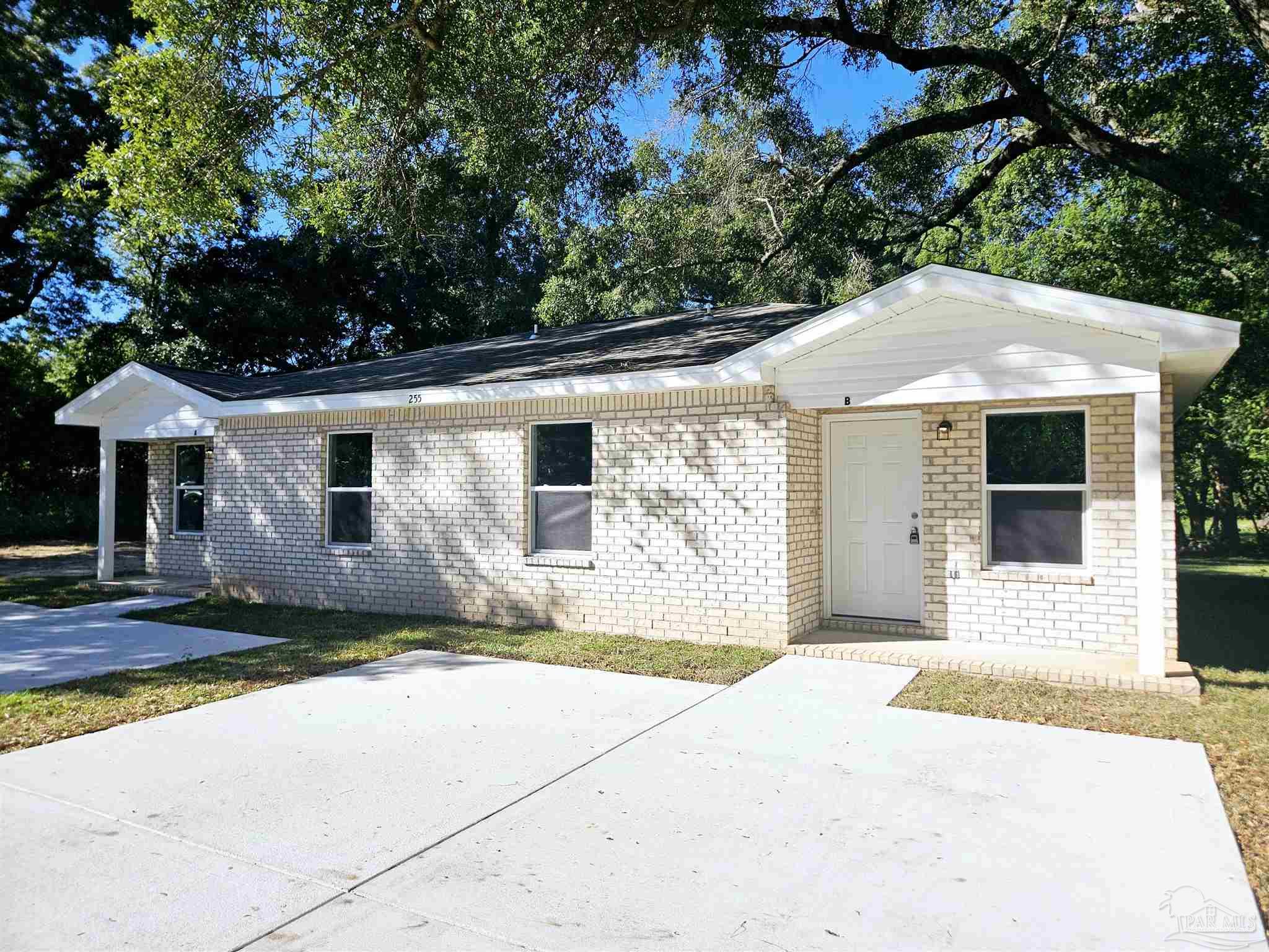 a front view of a house with yard