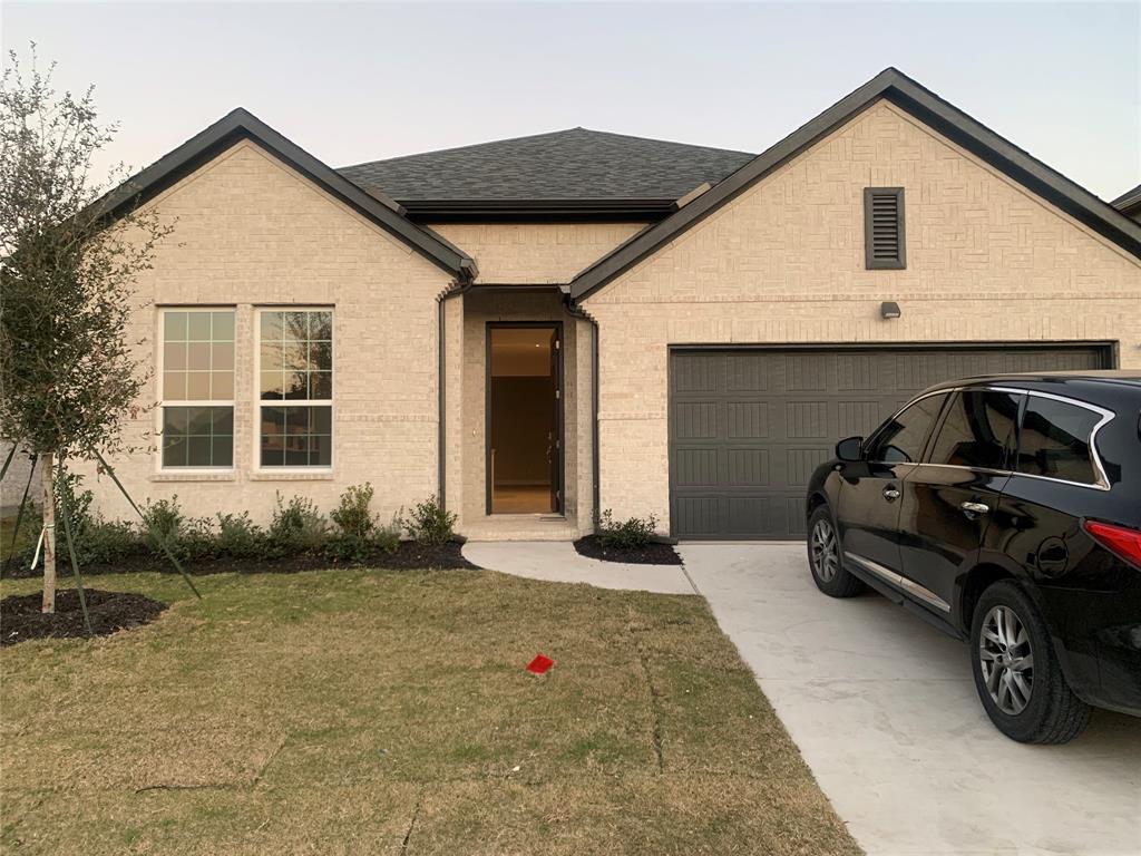 a view of a car in front of a house