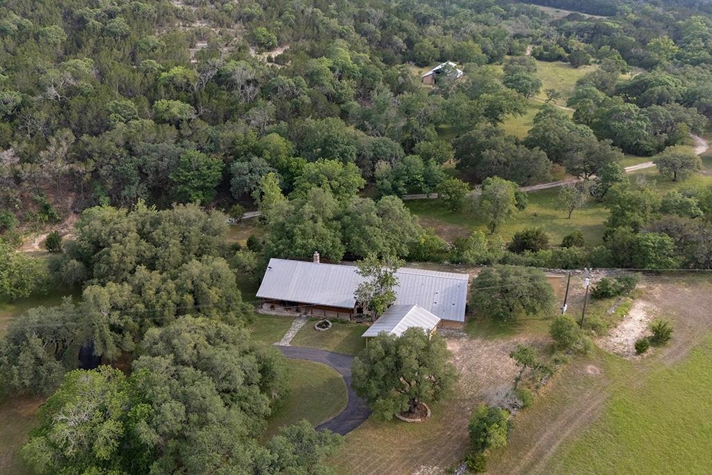 an aerial view of a house with a yard