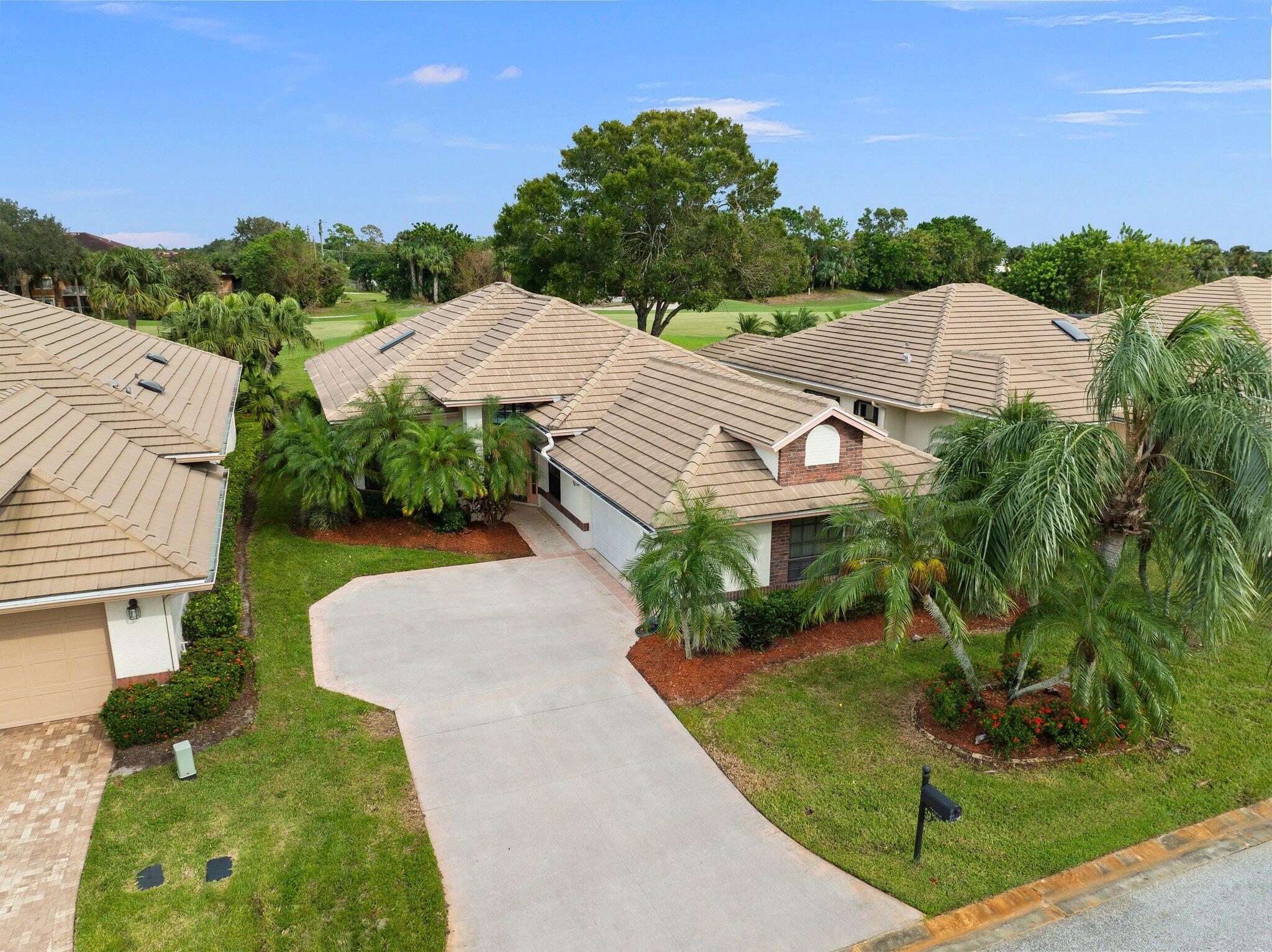 an aerial view of a house with a garden