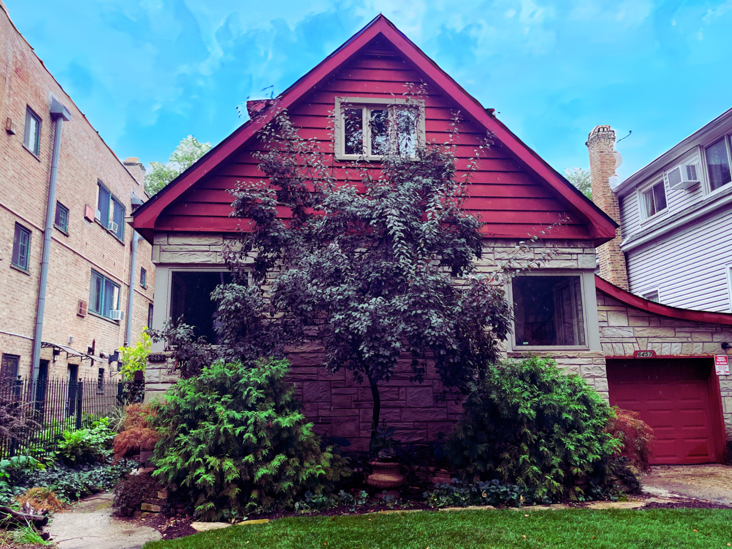 a front view of a house with garden