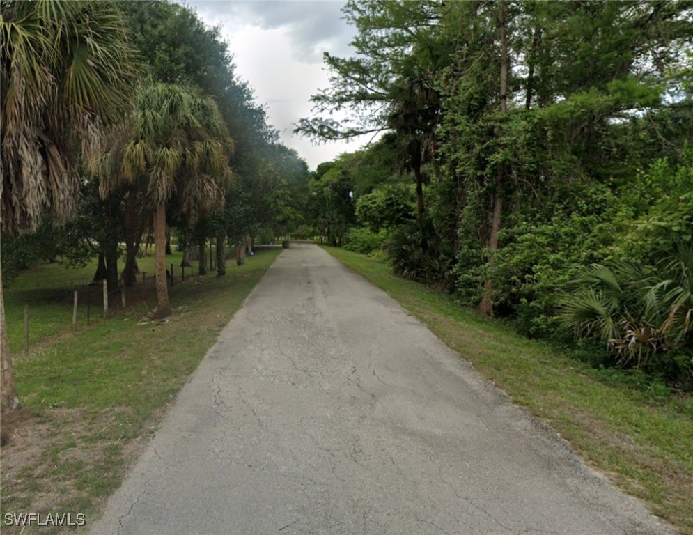 a view of a street with a trees