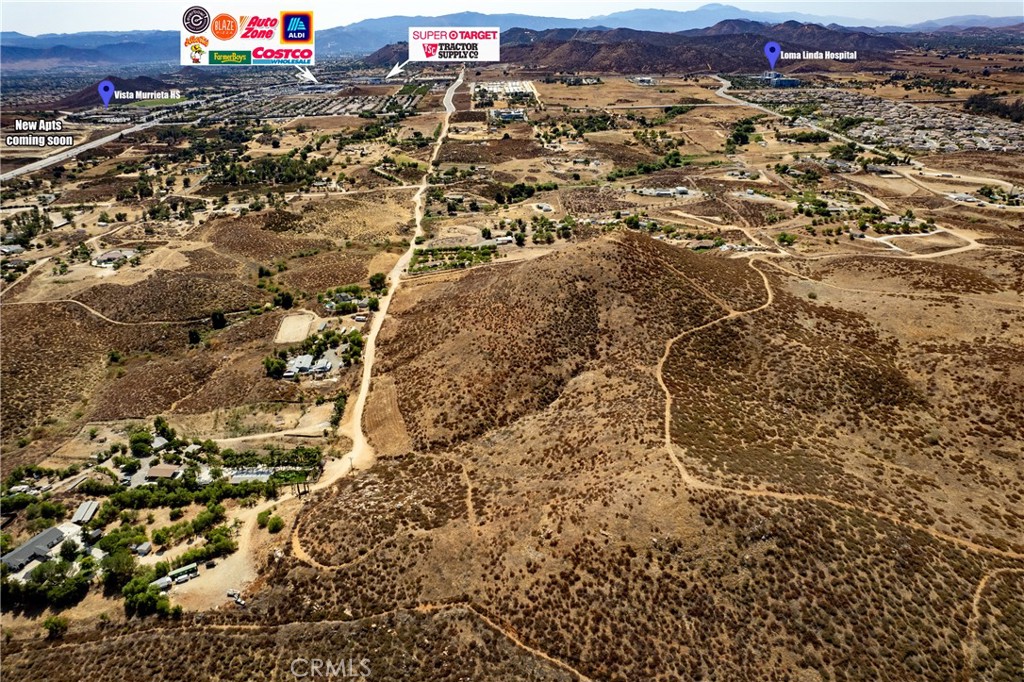 an aerial view of residential houses with city view