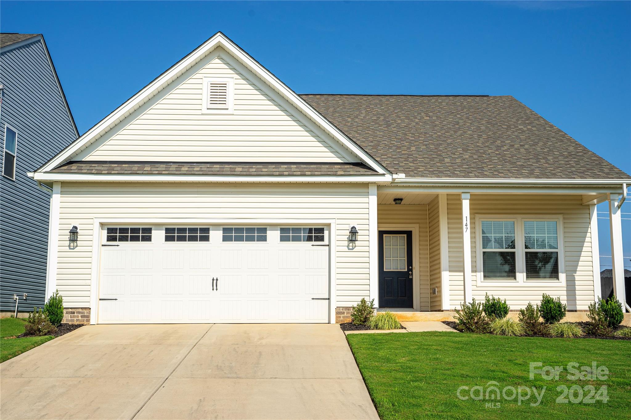 a view of house with yard