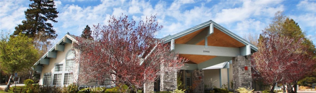 a view of a house with a tree