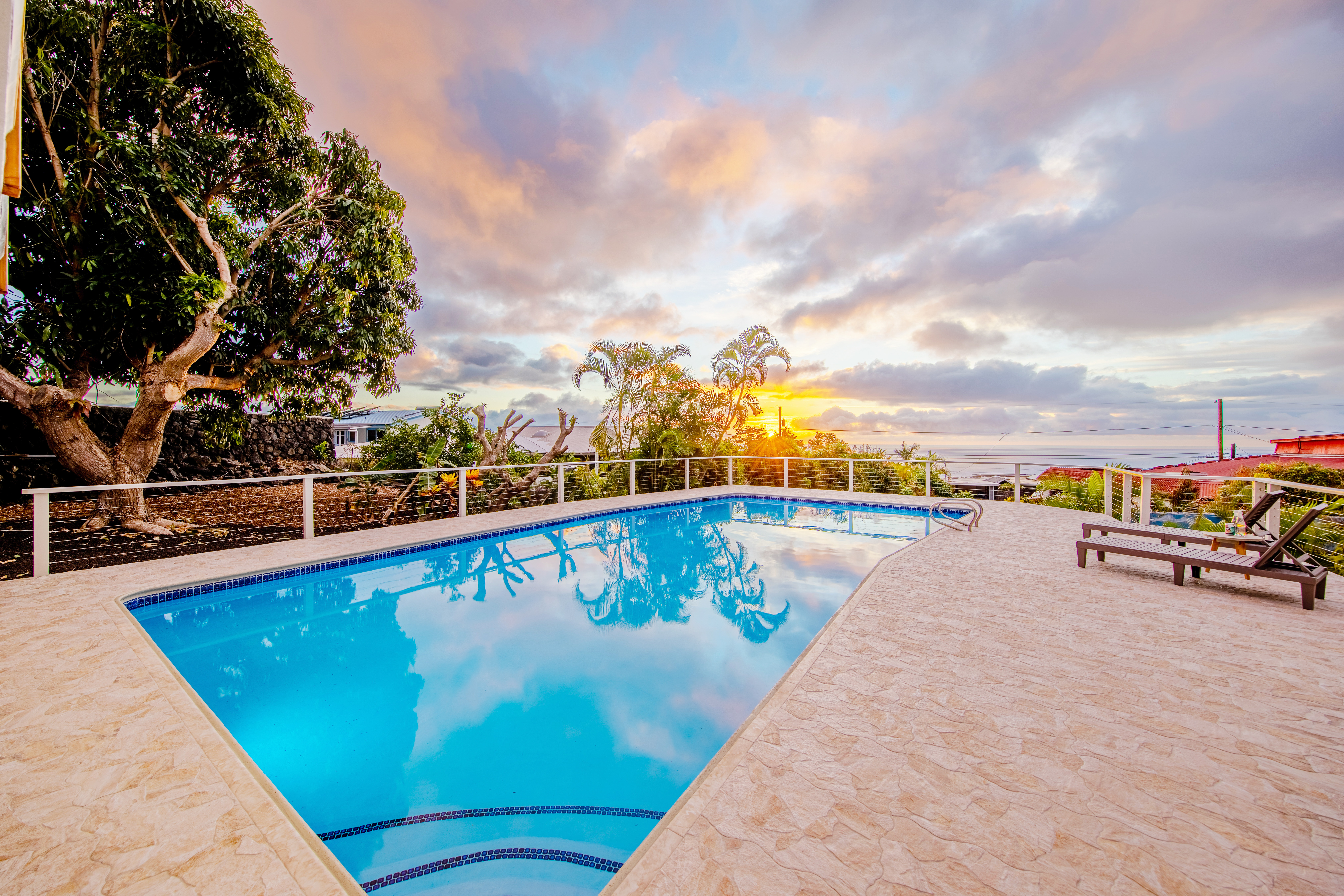 a view of swimming pool with a lounge chair