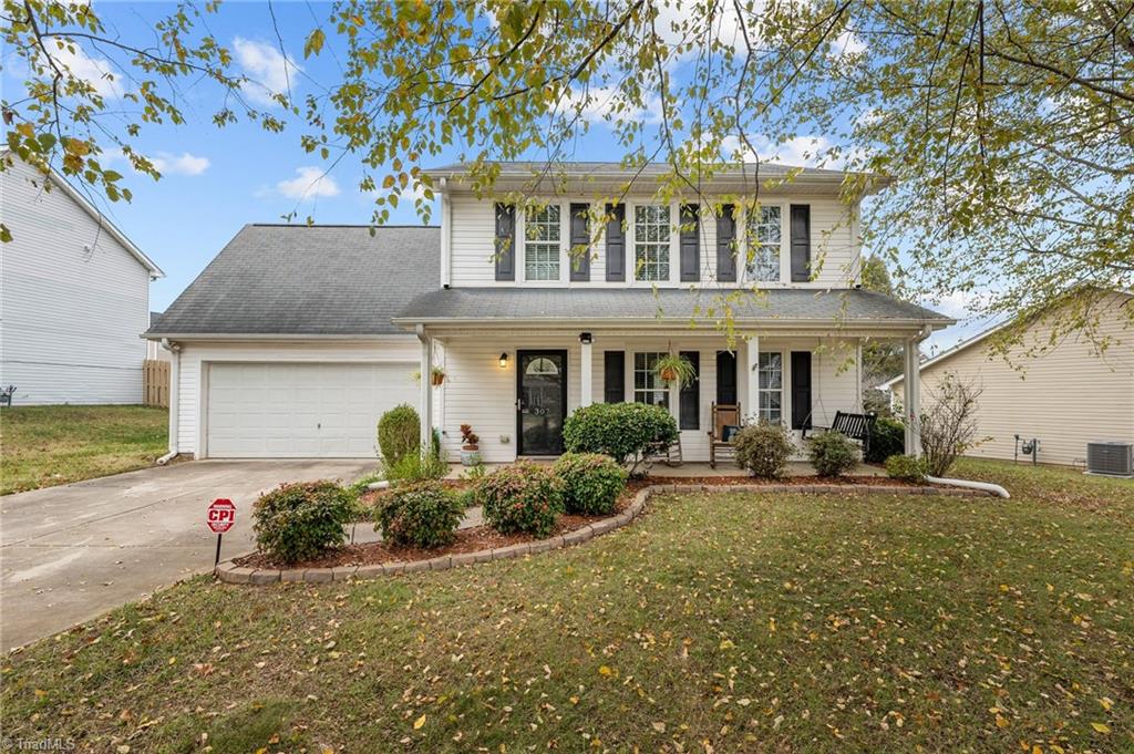 This traditional 3 bedroom home has two car garage, covered front porch and picturesque landscaping.