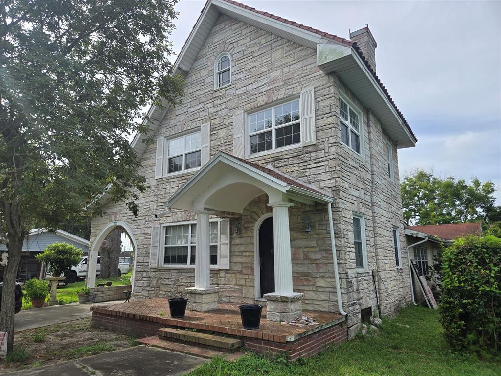 a front view of a house with garden