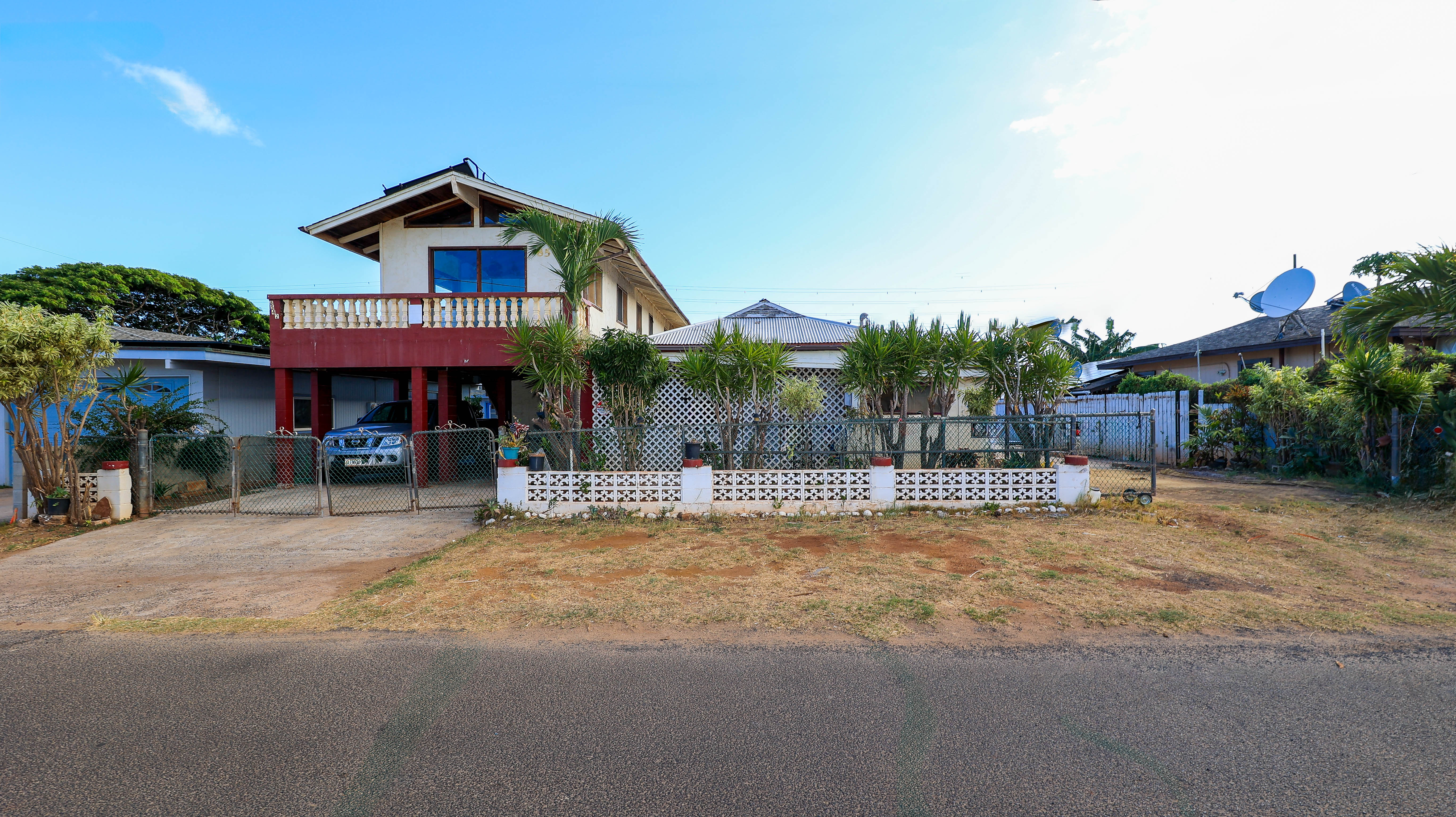 a view of a house with sitting area and garden