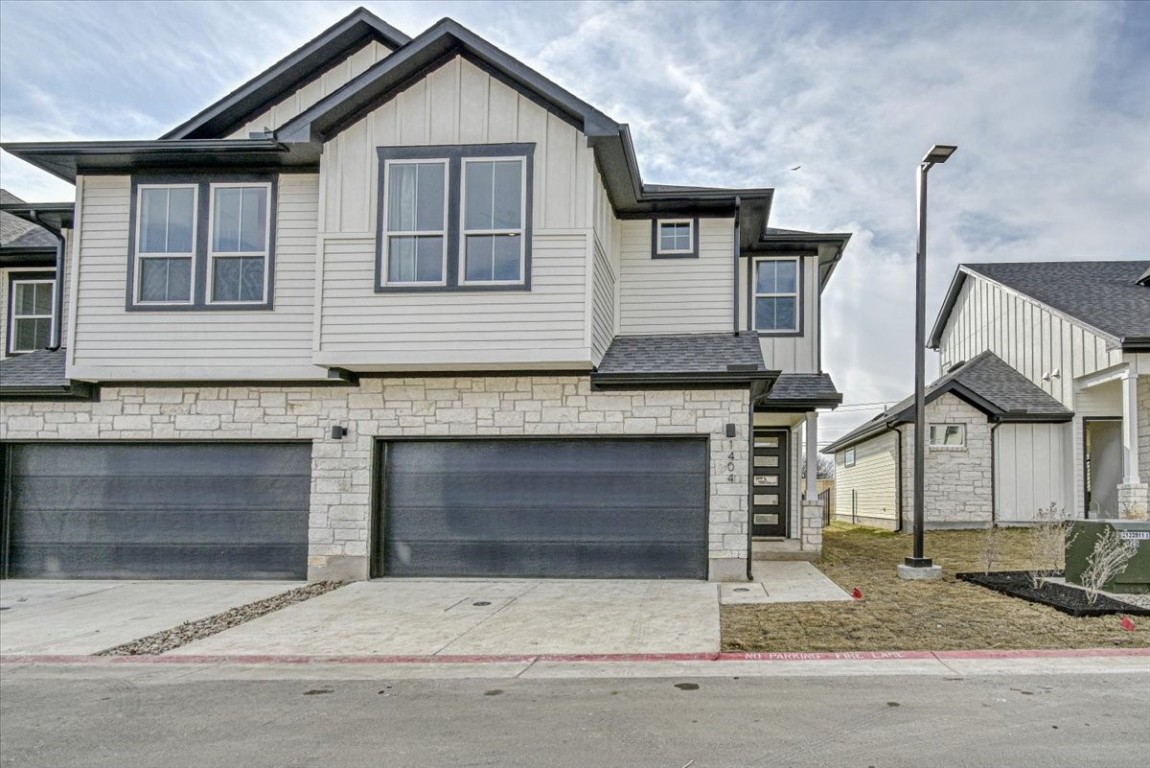 a front view of a house with garage