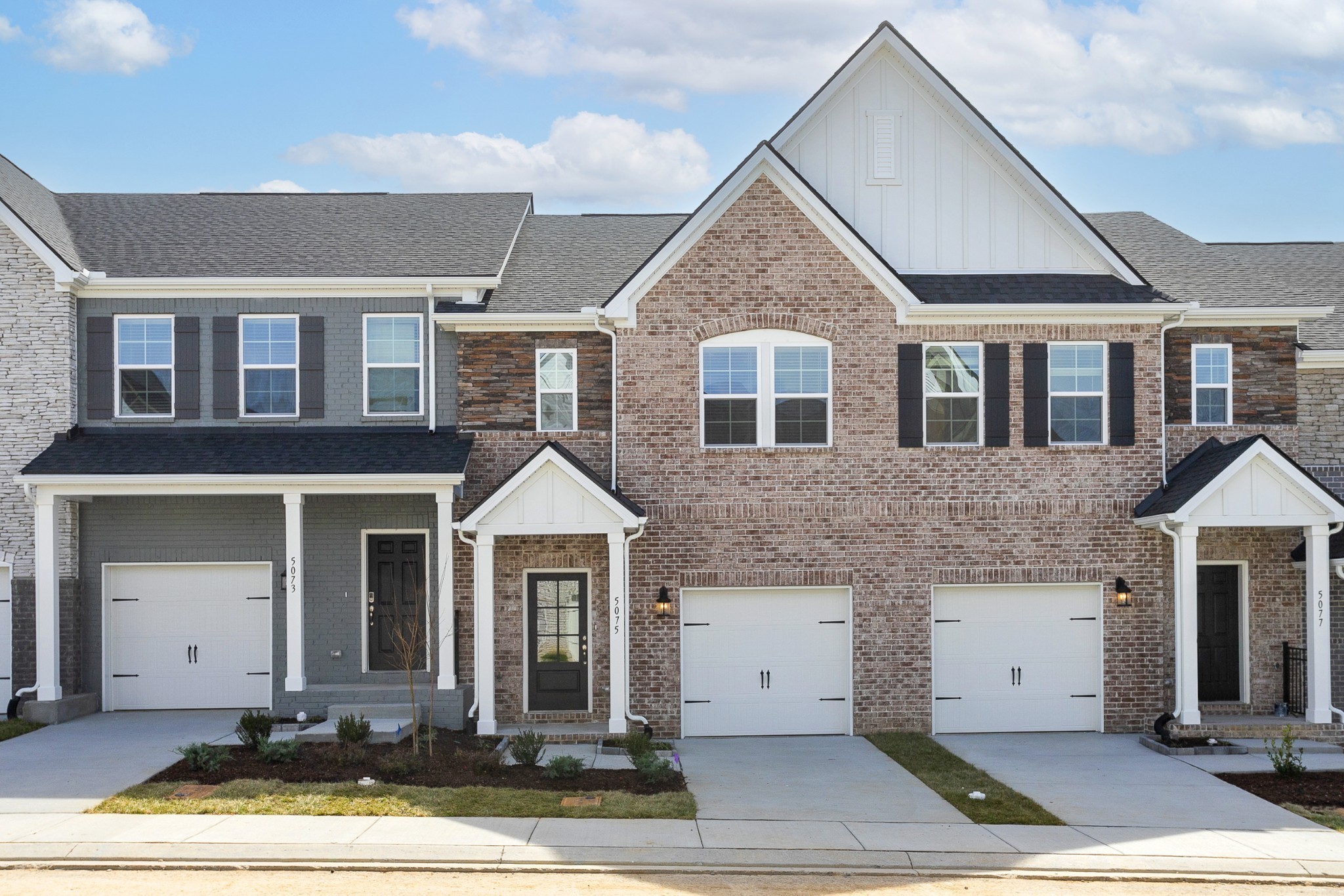 a front view of a house with yard